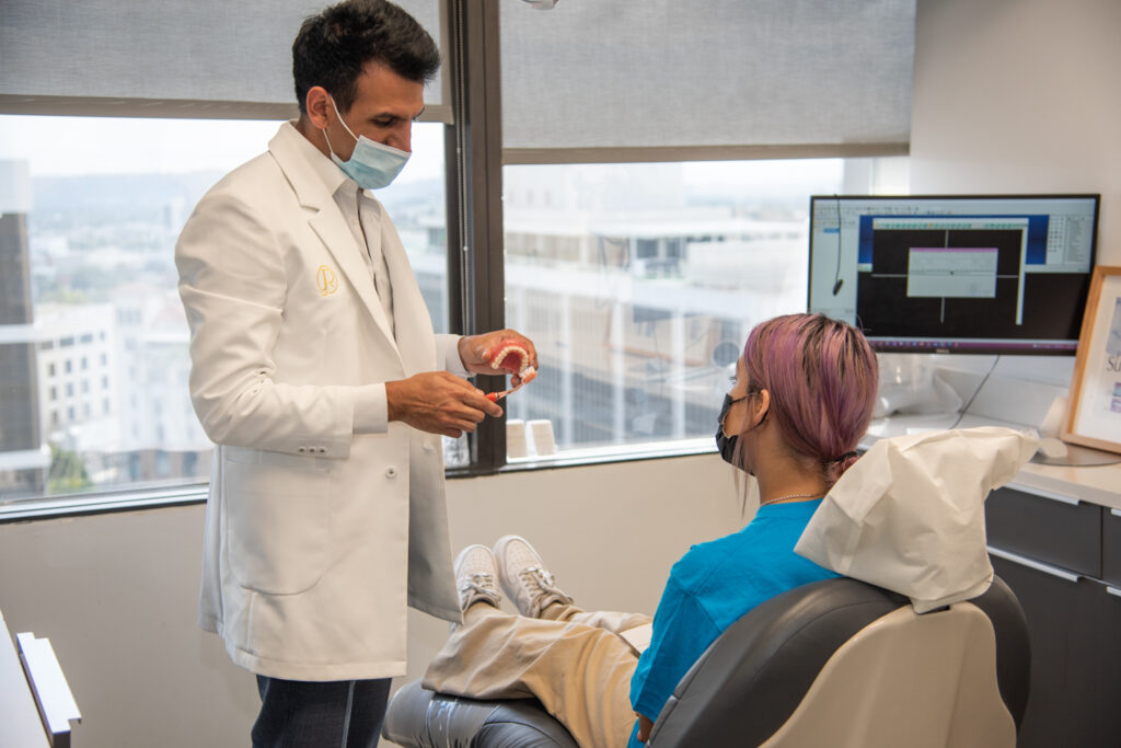 Experienced periodontist smiling confidently, representing the expert care available when choosing a periodontist in Beverly Hills