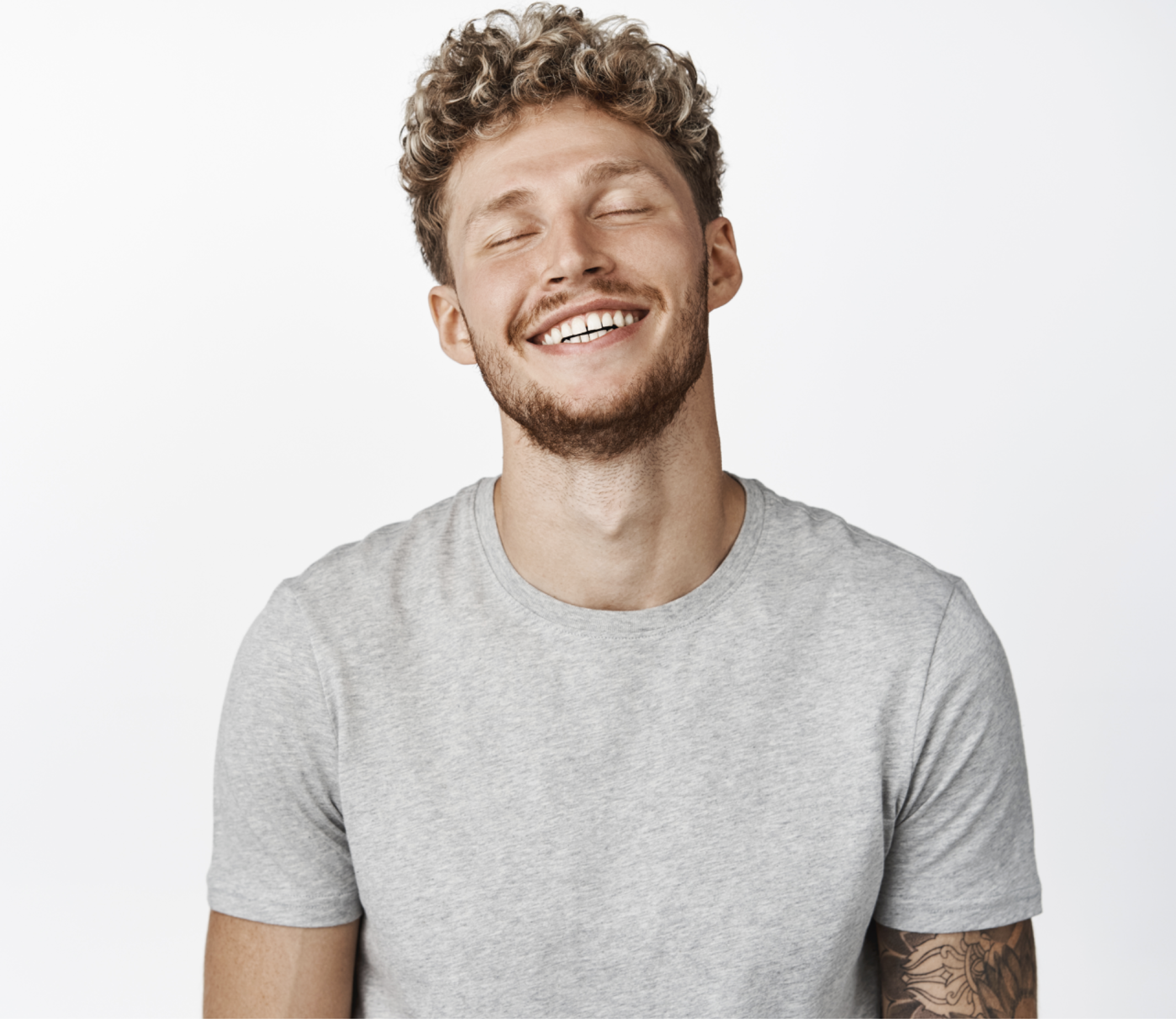 A man showing perfect white smile after Porcelain Veneers Fix Imperfections treatment in Beverly Hills
