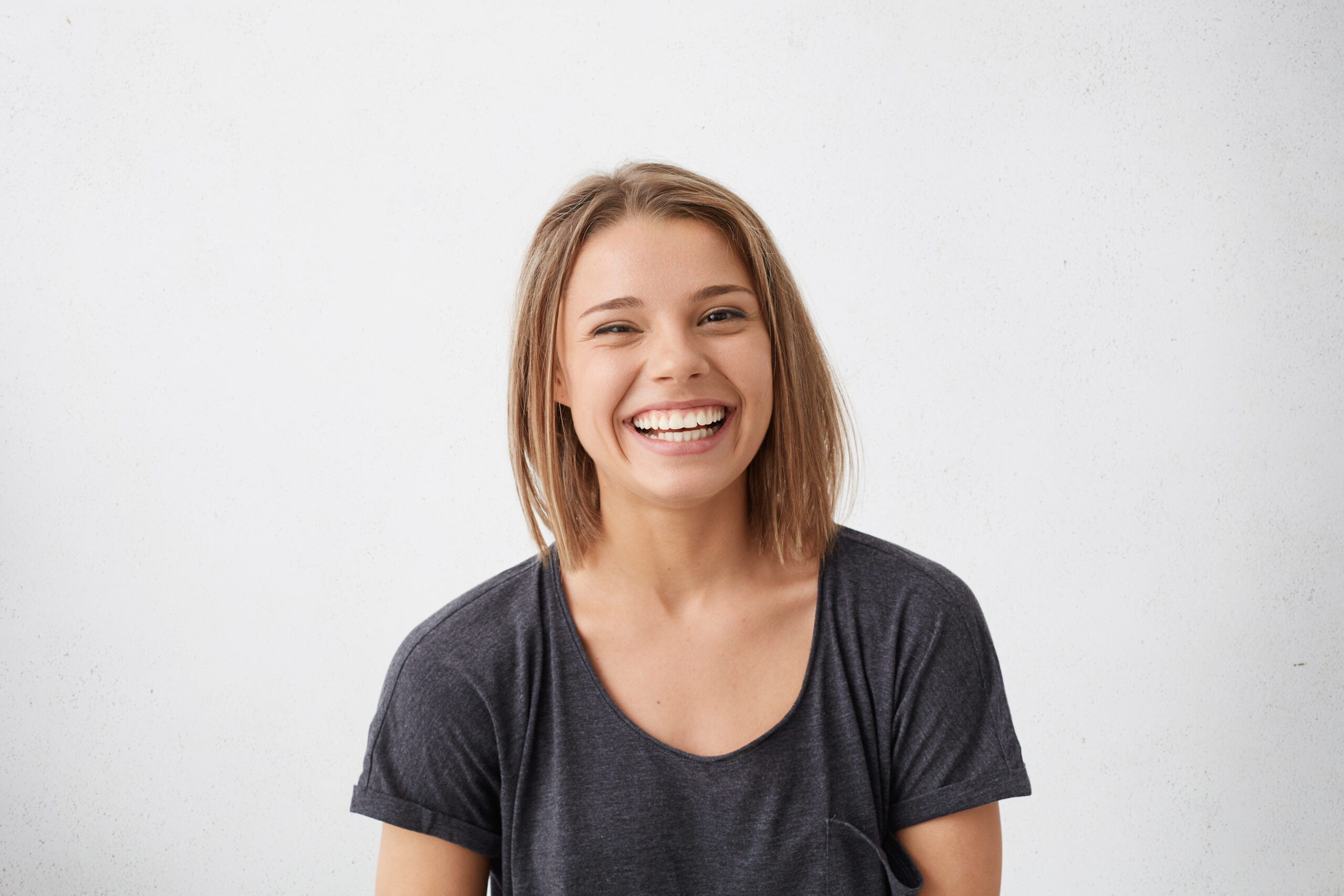 Healthy teeth and gums demonstrating the benefits of a balanced oral microbiome.