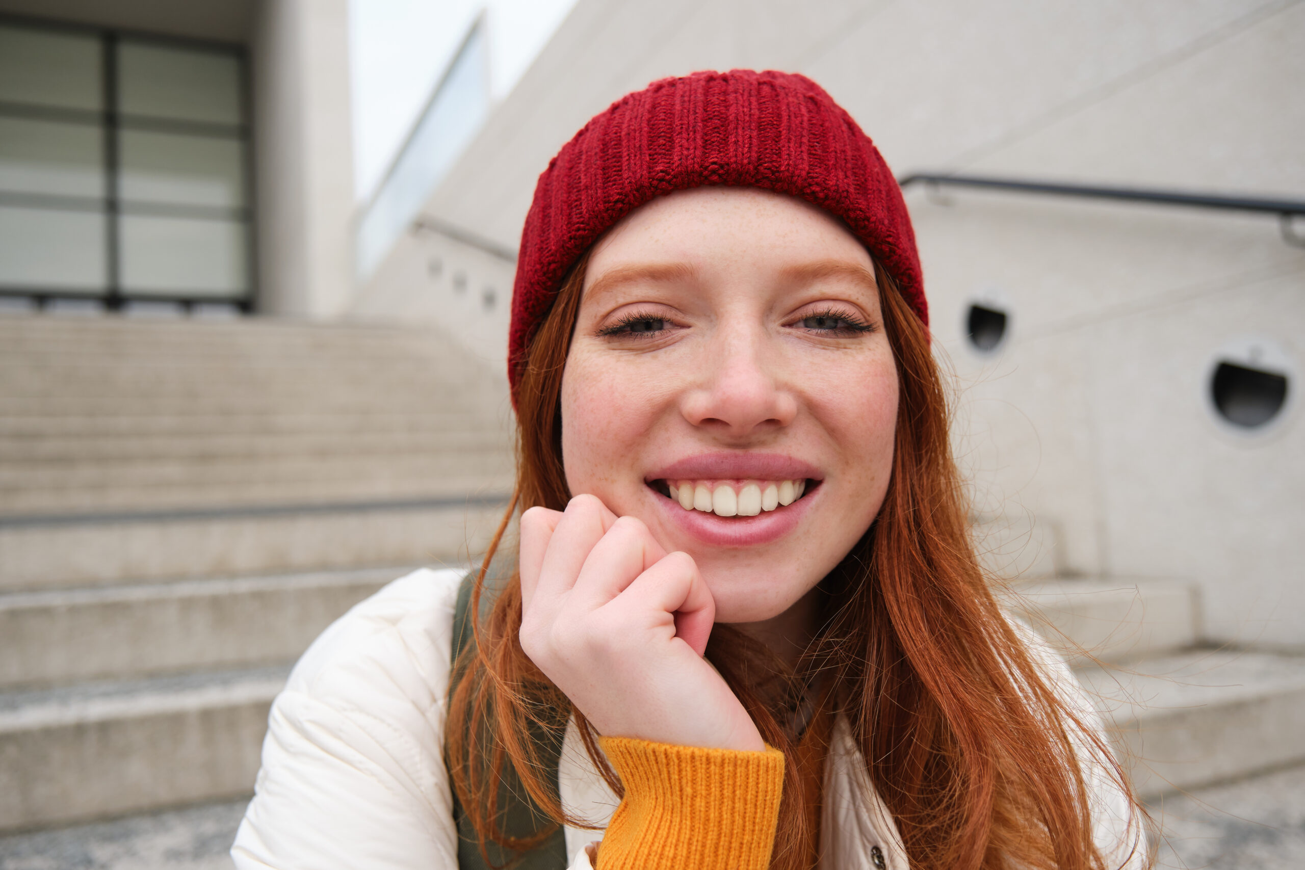 A happy student, showcasing a healthy smile, free from any signs of Damaging your Gums in Beverly Hills.