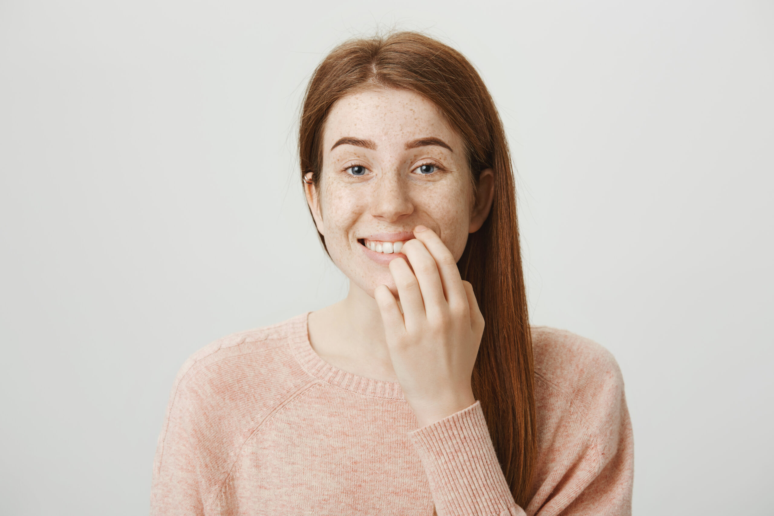 A smiling woman showing a healthy smile after successful Gum Disease Treatment in Los Angeles.