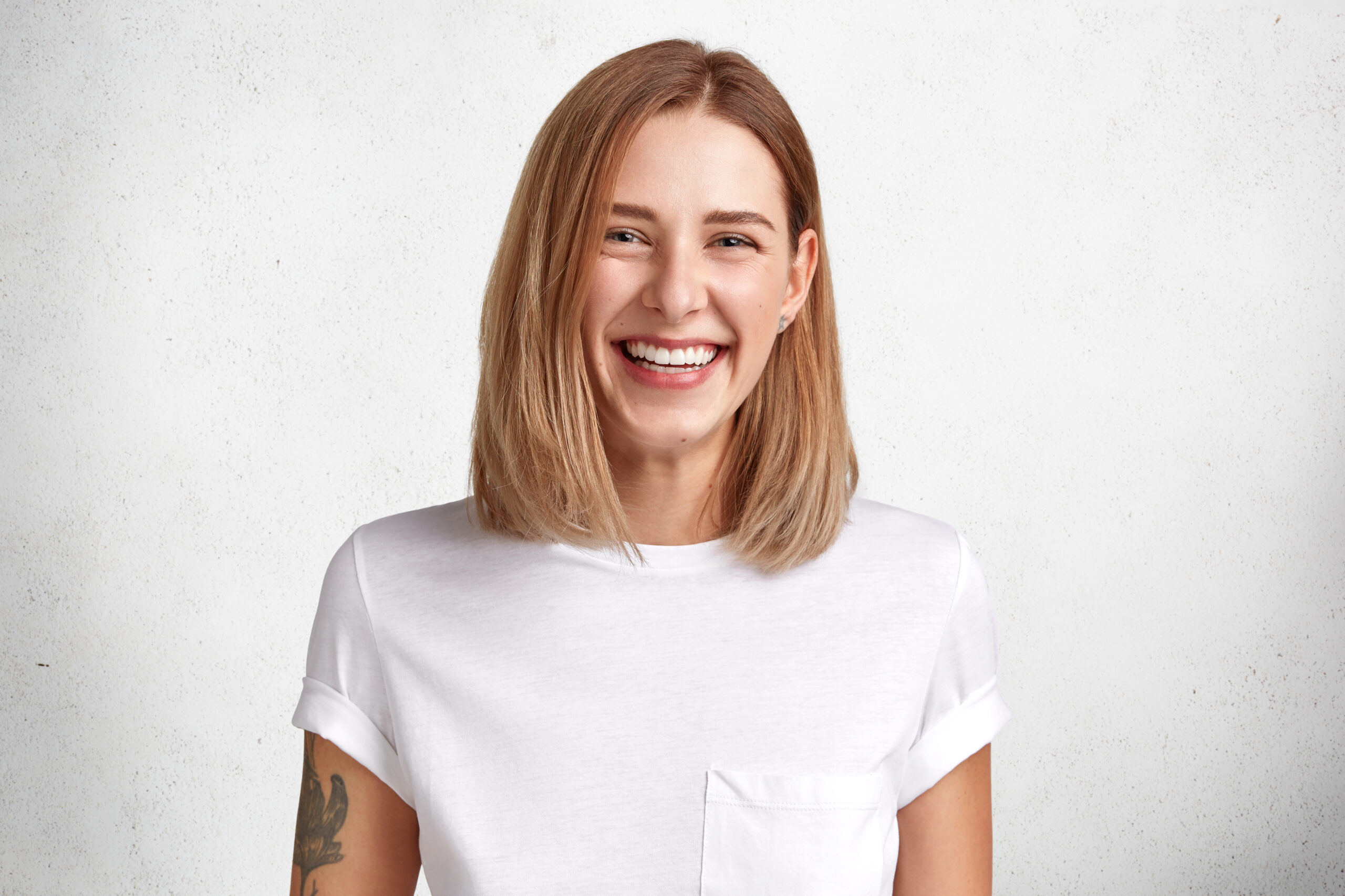 A woman with a beautiful smile, showcasing the results of All on 4 versus Individual Implants in Beverly Hills.