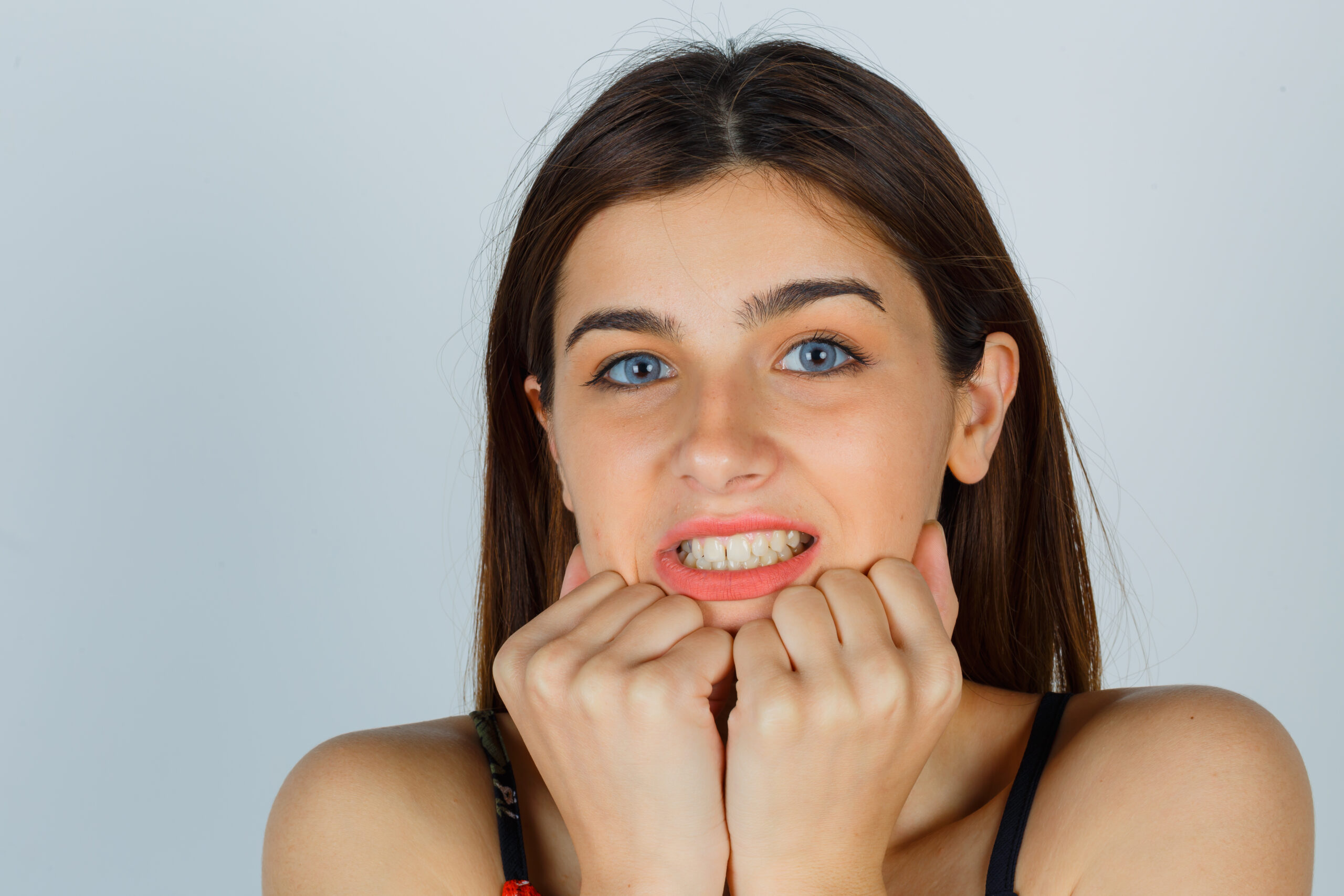 A woman looking concerned, highlighting the importance of Early Detection of Gum Disease